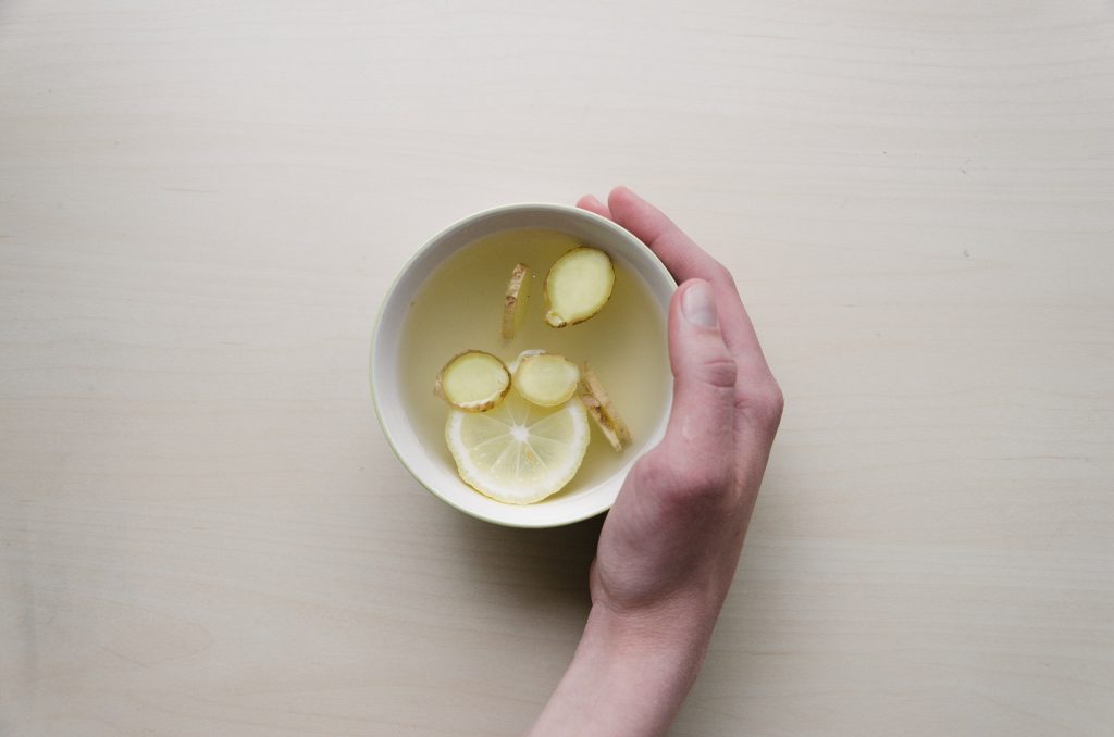 cup of ginger and lemon tea flat lay morning sickness remedies