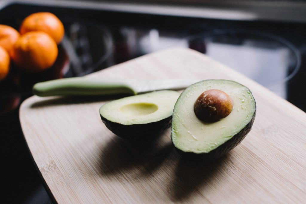 styled photo of an avocado cut in half morning sickness remedies